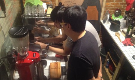 Phat Uncle Hendri Kurniawan monitors Otniel as he is learning to pull a shot of espresso in our ABCD Class.